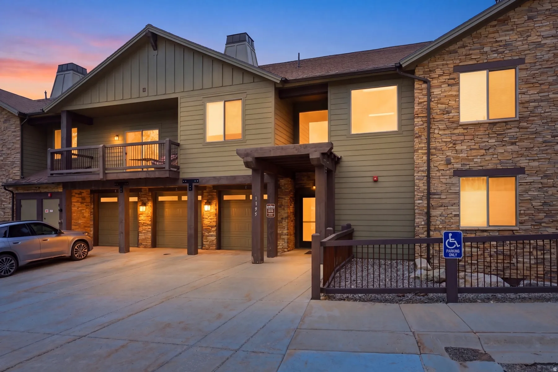 Multi-unit property with a stone and siding exterior