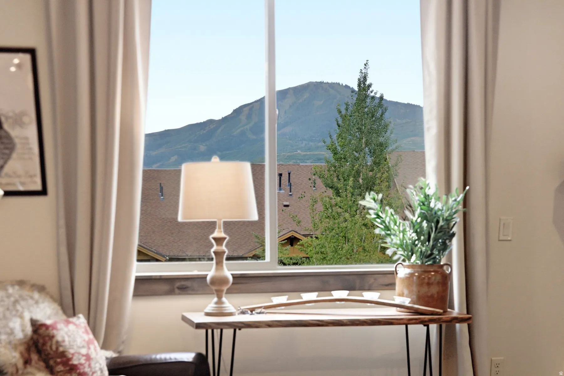 Expansive window framing a mountain backdrop