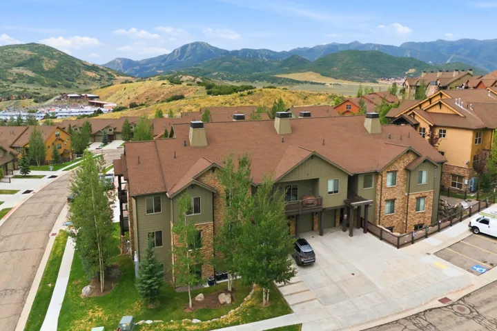 Mountain-inspired architecture featuring a multi-level design with a prominent brown roof