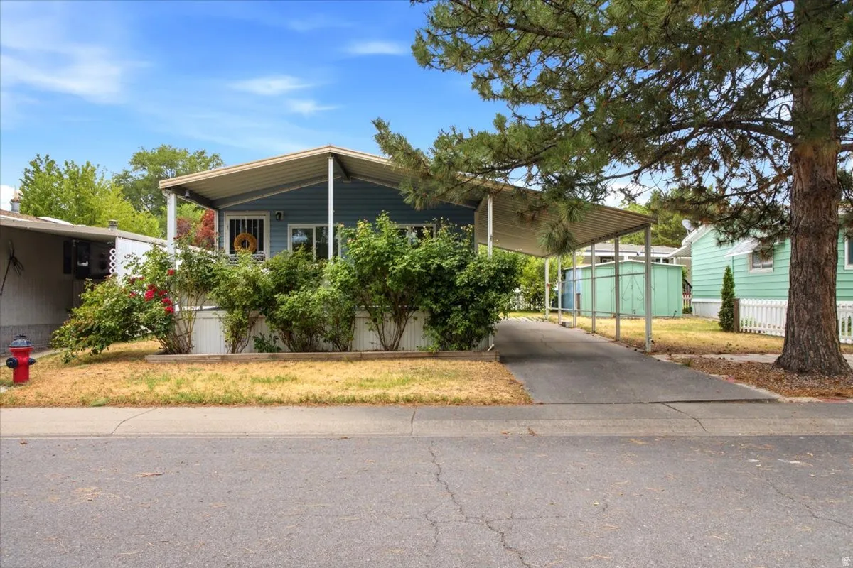 Light blue siding exterior with a covered porch