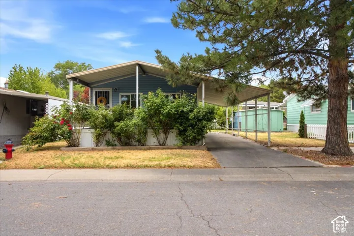 Light blue siding exterior with a covered porch