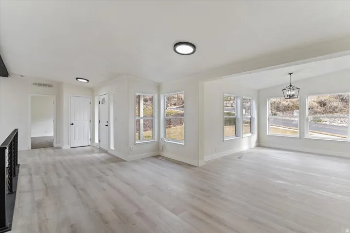 Spacious interior featuring light wood-finish flooring throughout