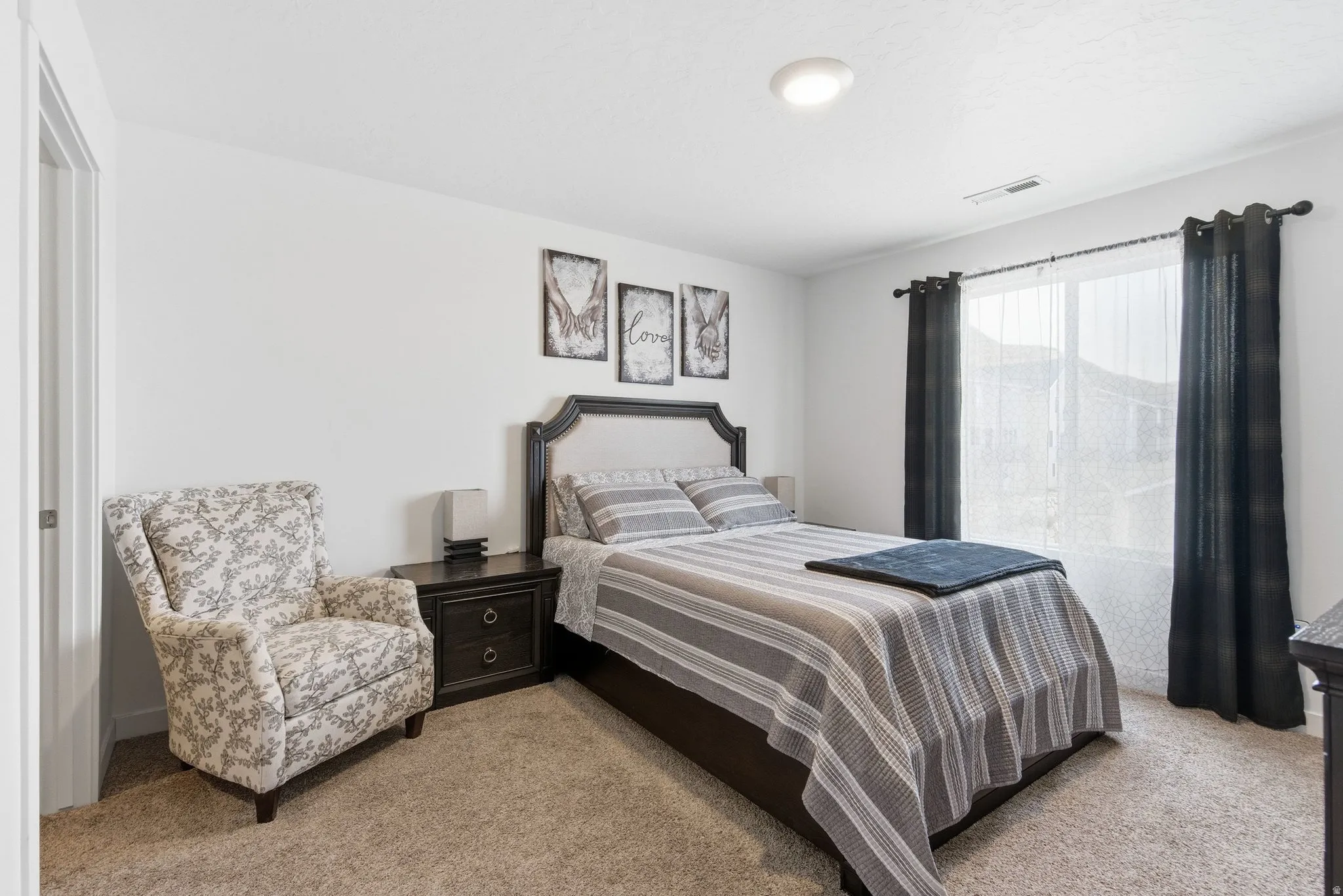 Neutral wall paint and carpeting throughout