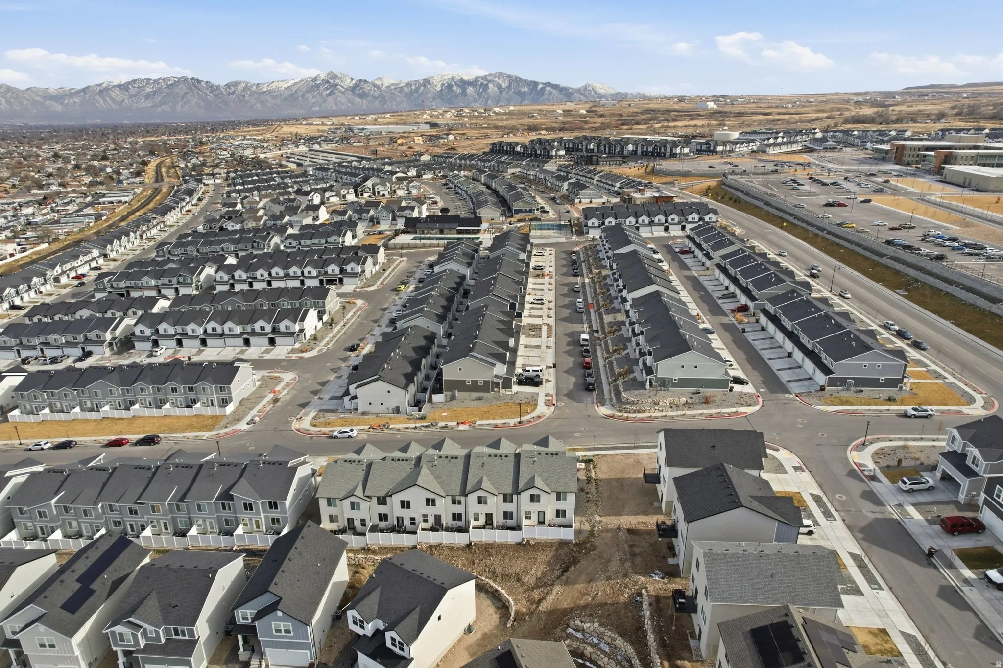 Extensive residential development featuring numerous multi-story homes with dark roofs