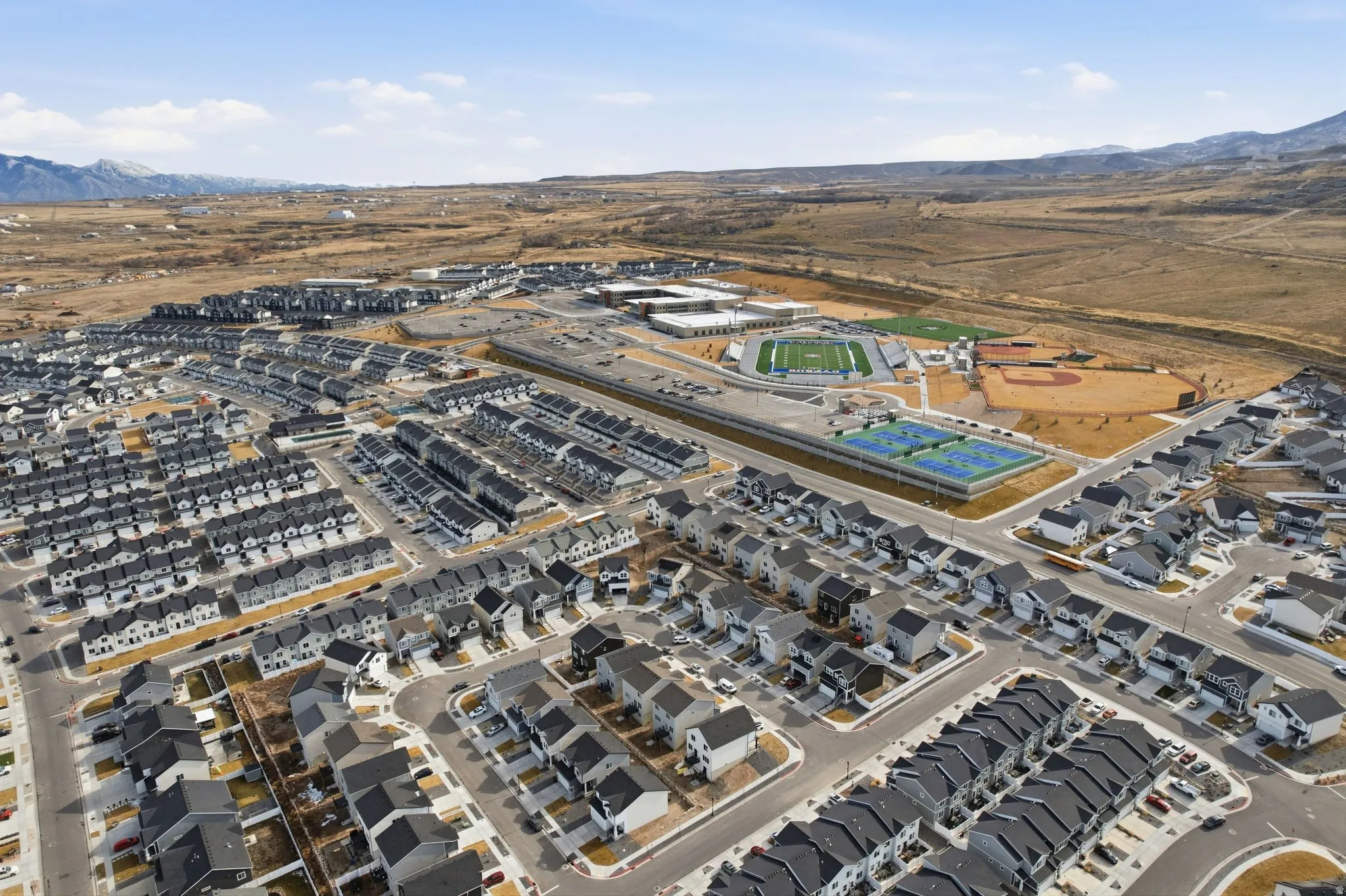 Expansive aerial perspective showcasing a residential community with contemporary homes