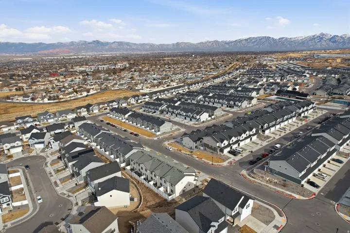 Aerial perspective showcasing a sprawling residential development with varied housing styles