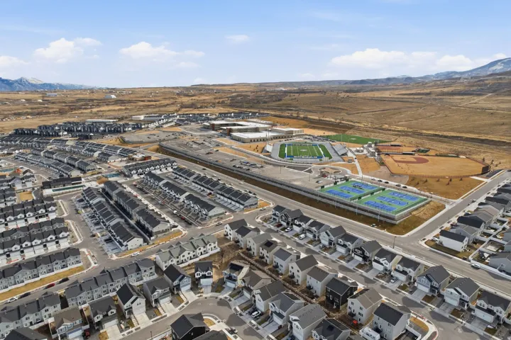 Aerial depiction of a residential community featuring rows of modern homes