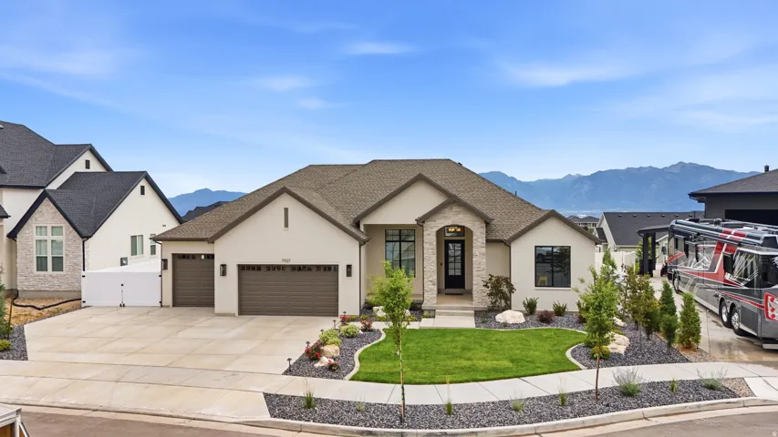 Contemporary single-story residence with a stone and stucco exterior
