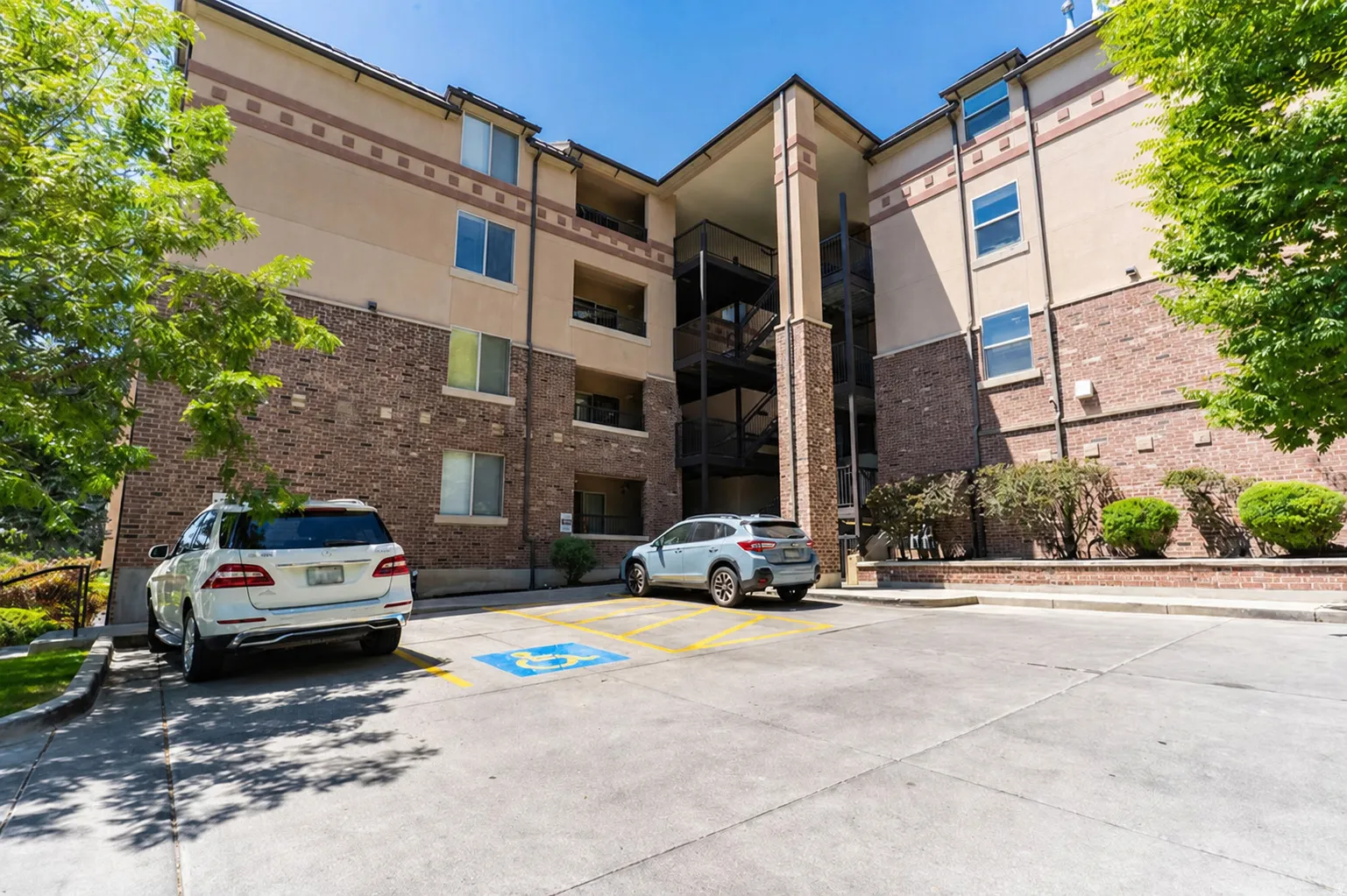Multi-story building featuring a brick and stucco exterior