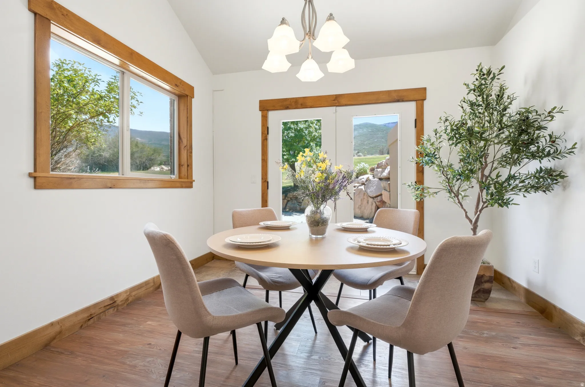 Dining space featuring wood-finish flooring and white walls