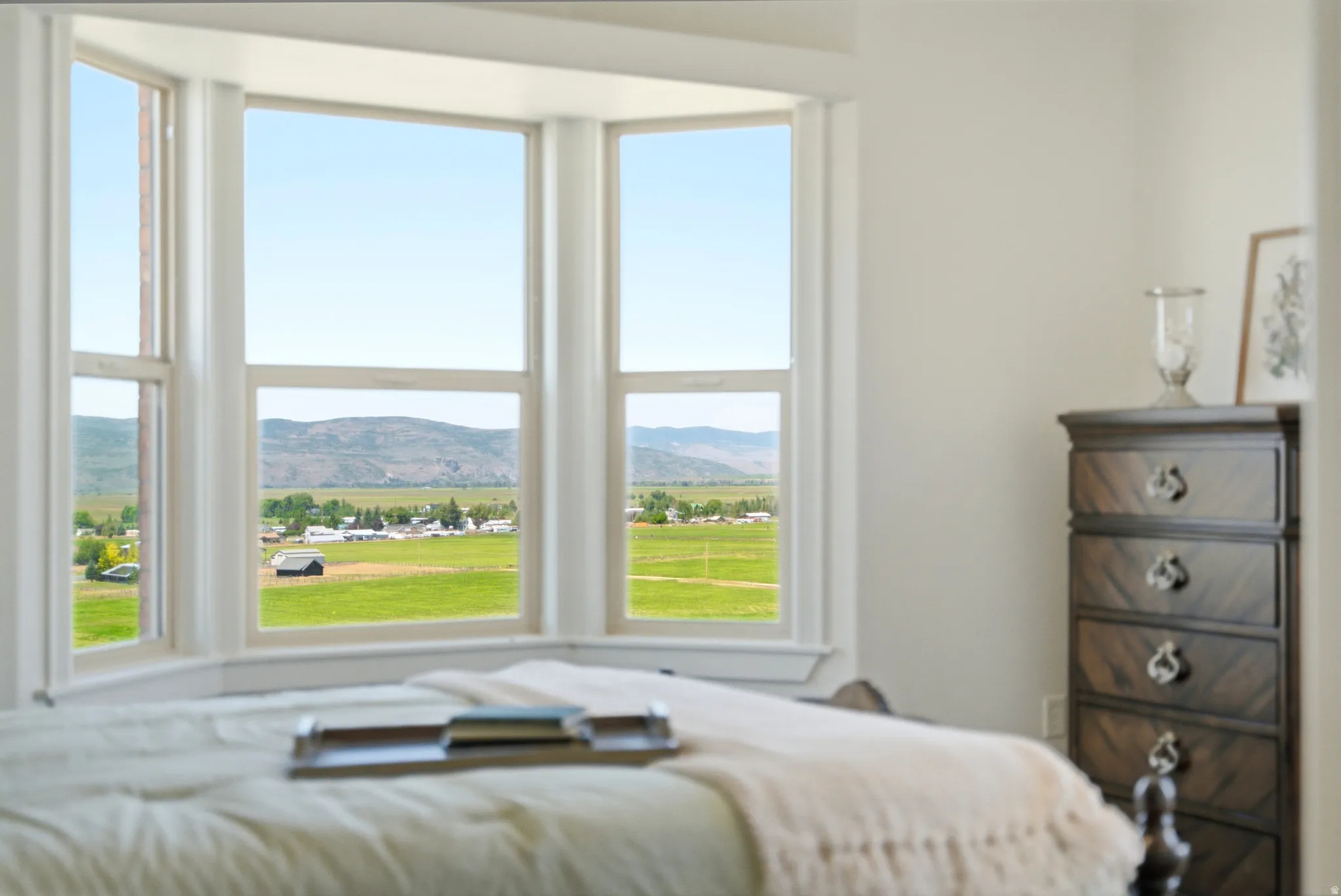 Bay window framing expansive mountain and valley scenery