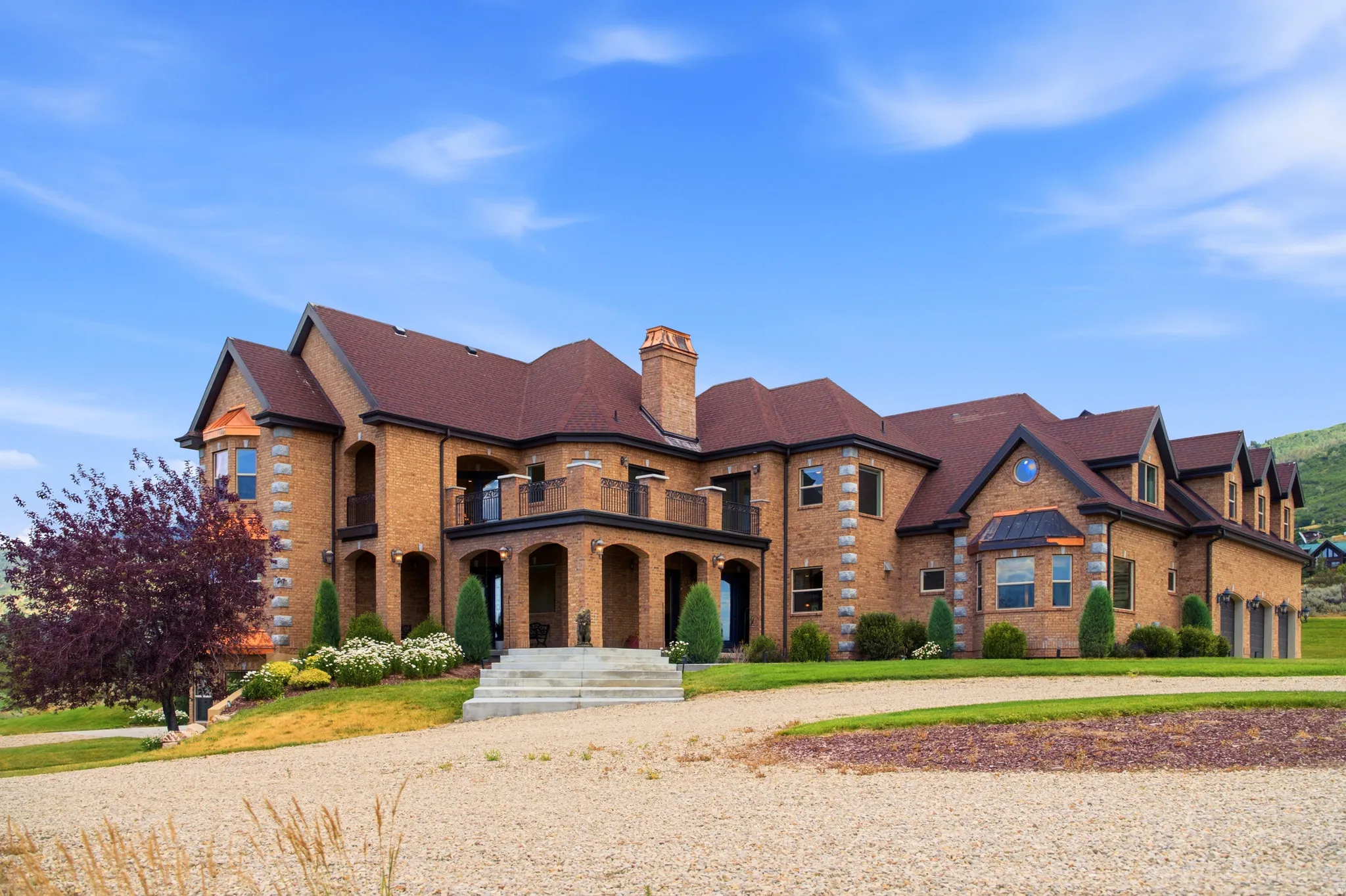 Stately brick exterior featuring a multi-level design