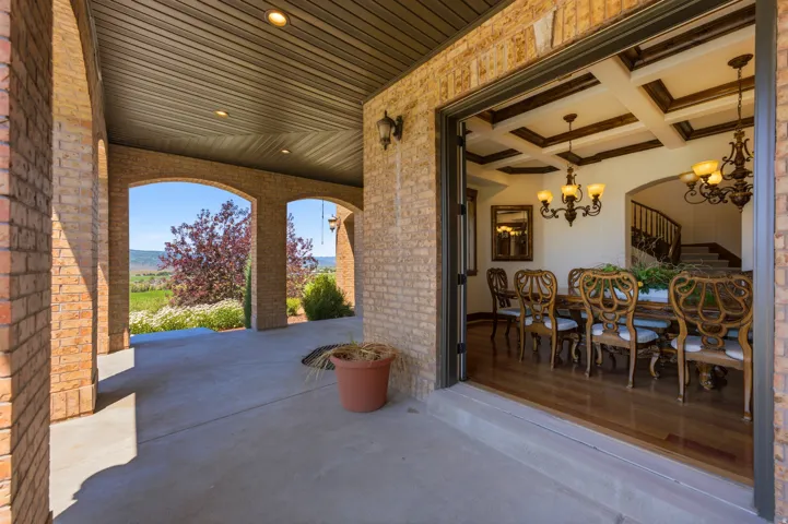 Brick archway patio with a coffered ceiling