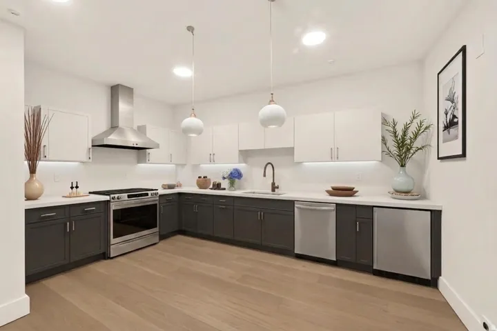 Virtual Contemporary kitchen featuring two-tone cabinetry, stainless steel appliances, and light wood-finish flooring