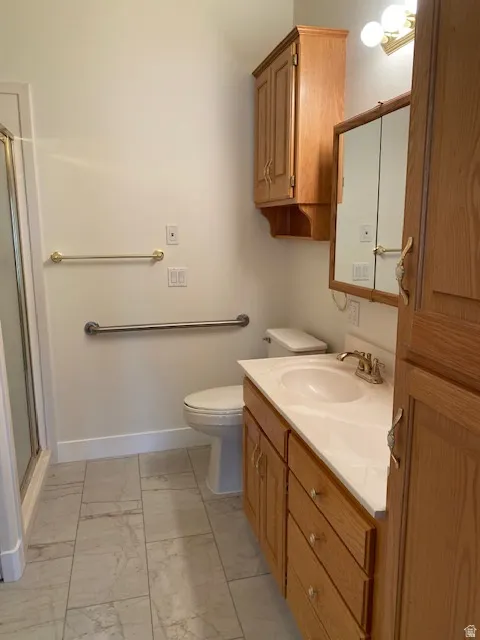Vanity with an integrated sink, wood-finish cabinetry, and a mirrored medicine cabinet