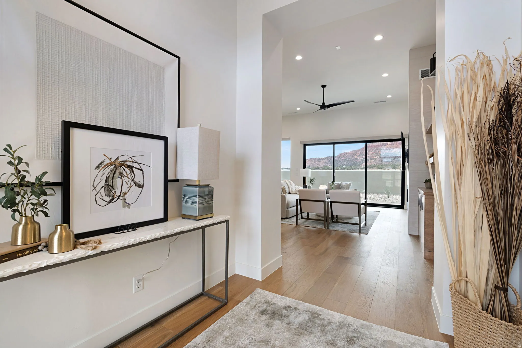Entryway featuring light wood-finish flooring, white walls, and a console table