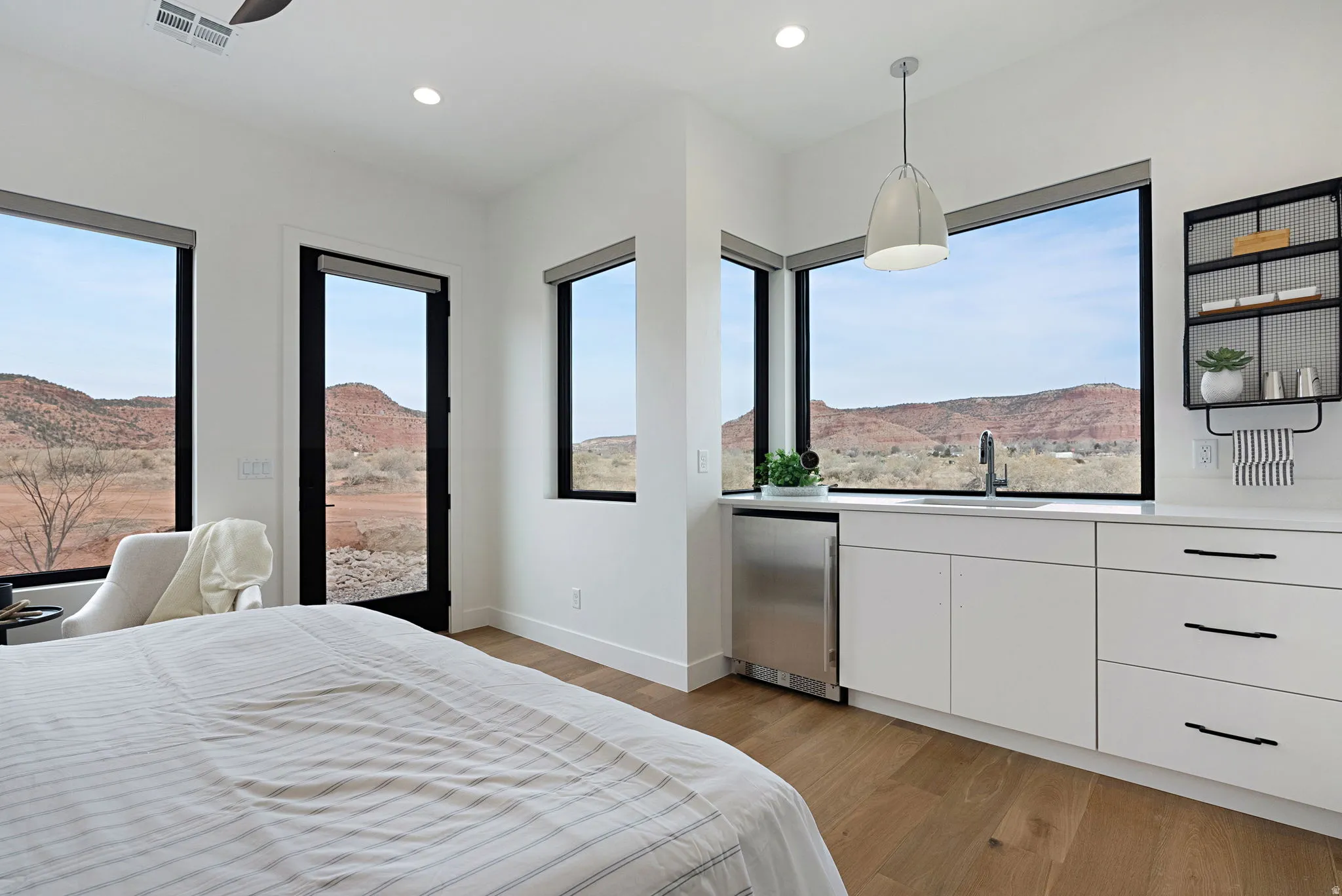 Expansive windows showcase a dramatic landscape
