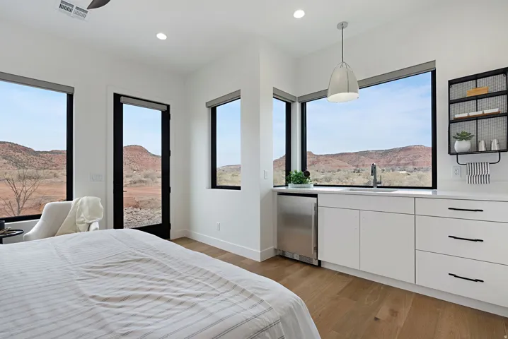 Expansive windows showcase a dramatic landscape