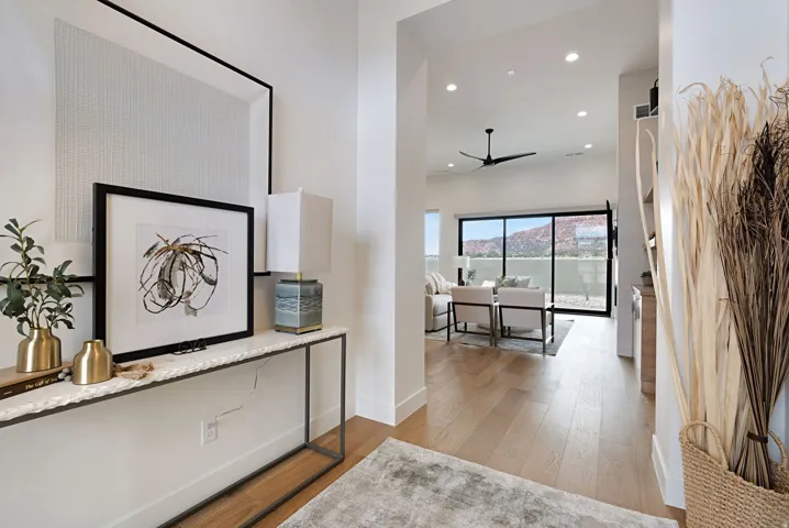 Entryway featuring light wood-finish flooring, white walls, and a console table