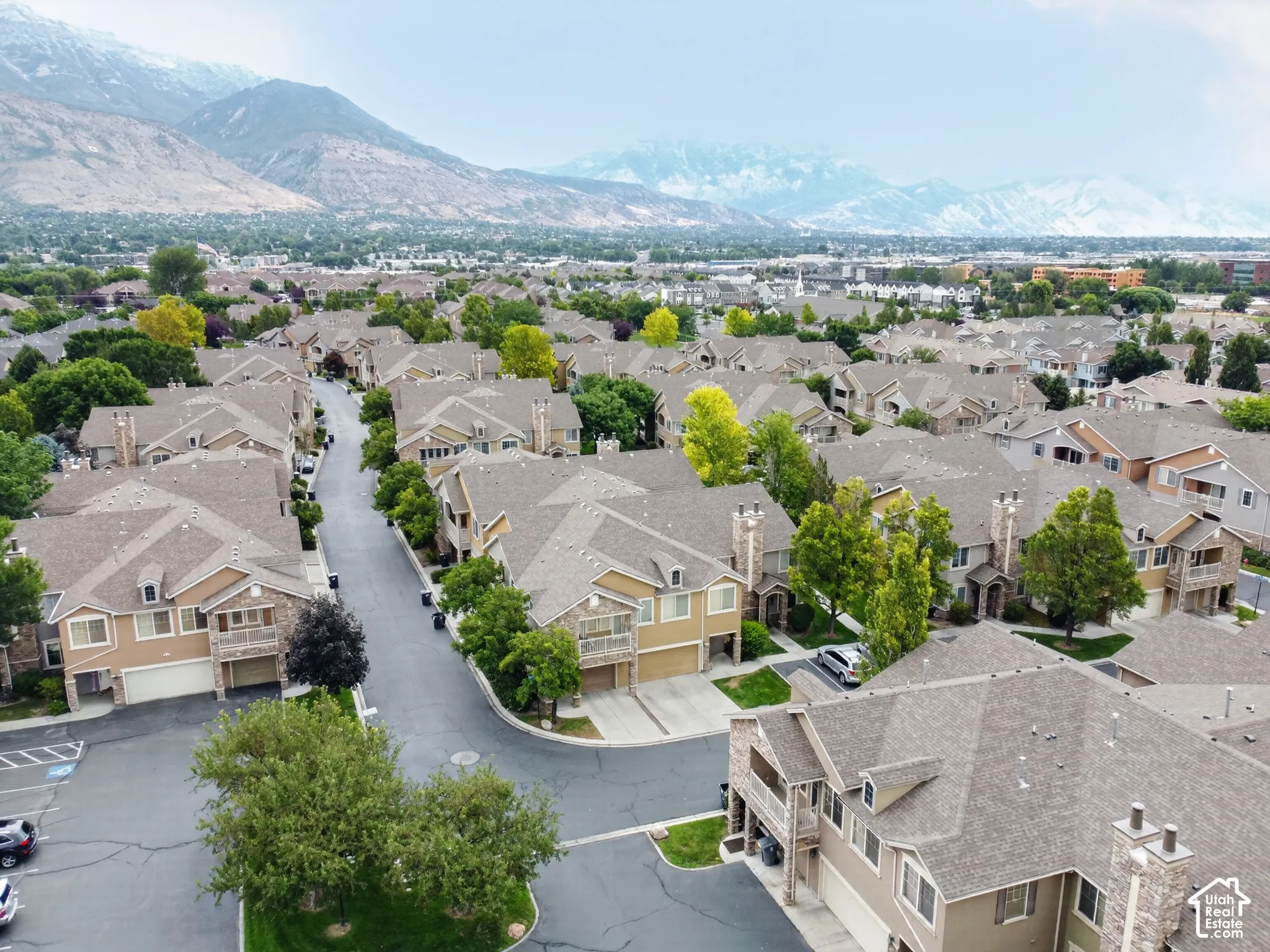 Aerial perspective showcasing a residential community with distant mountain scenery