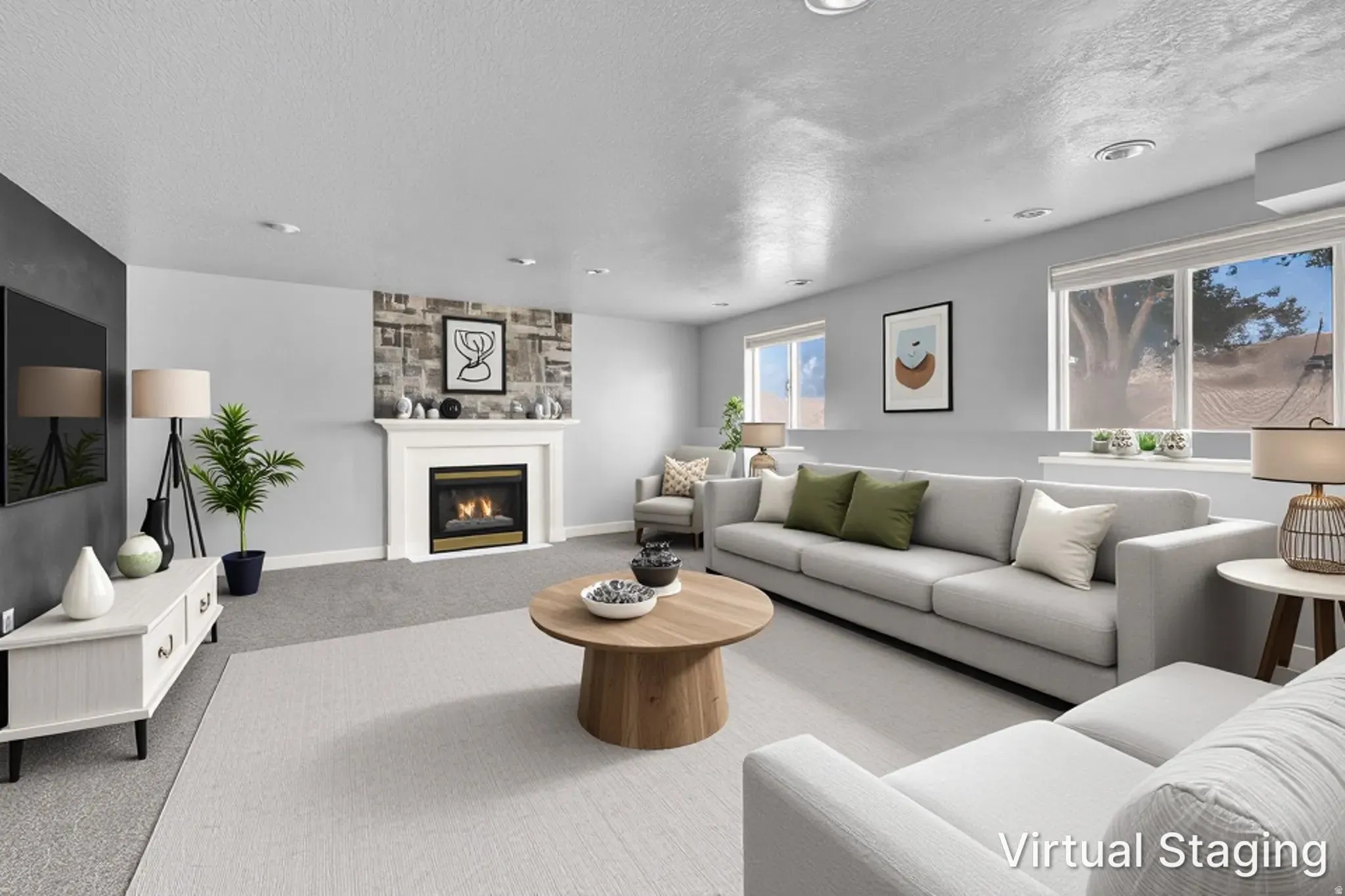 Spacious living area featuring a central fireplace with decorative surround, recessed lighting, and large windows