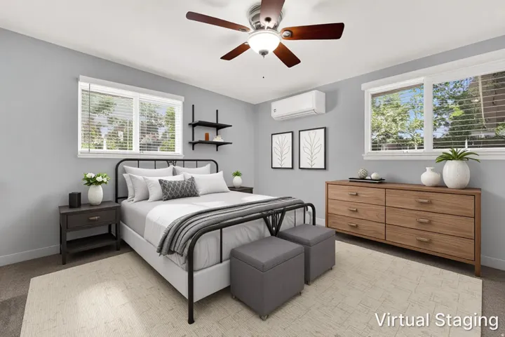 Bright room featuring light gray walls and recessed lighting