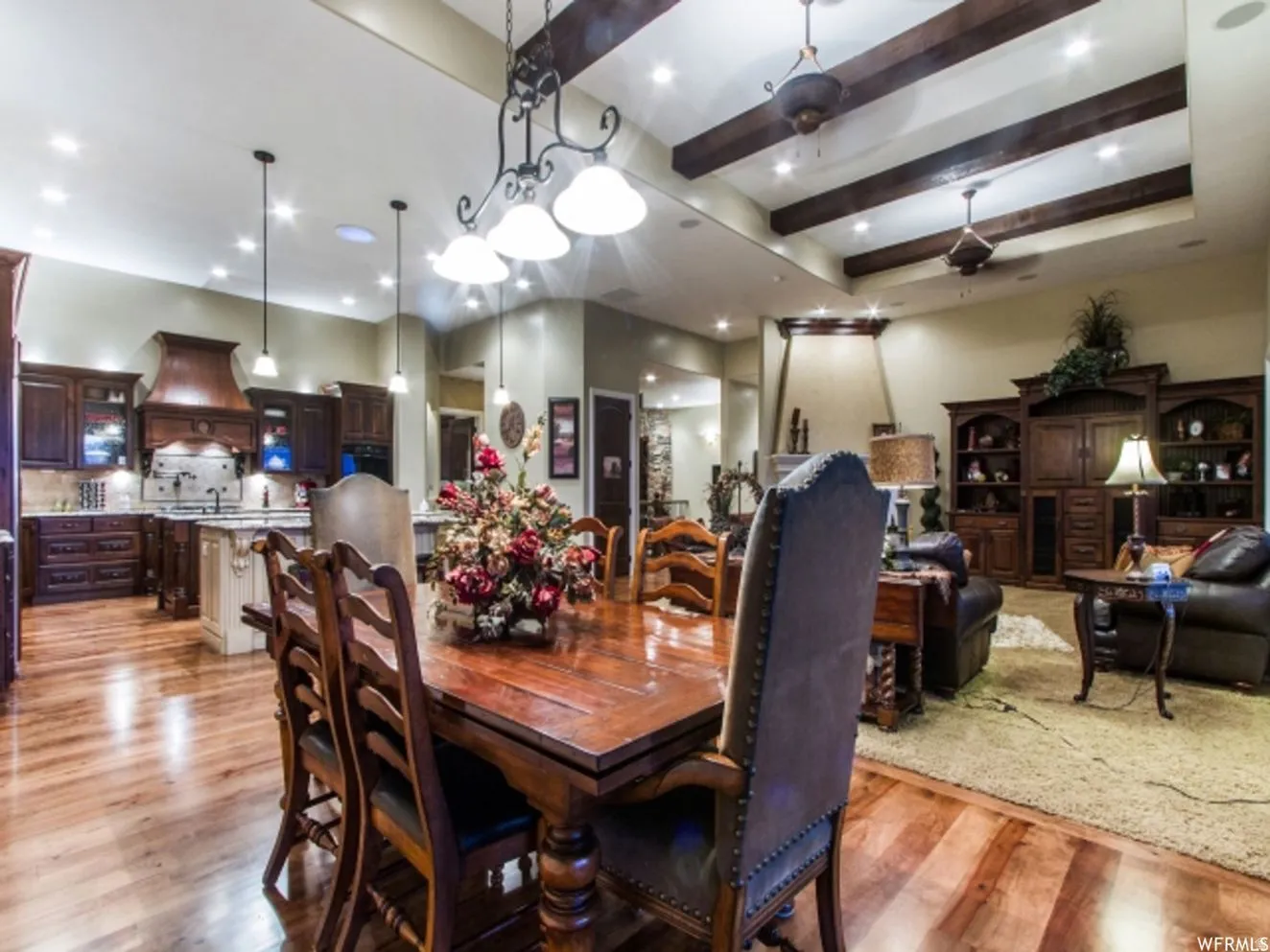 Open-concept living space featuring wood-finish flooring throughout