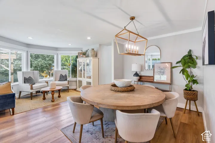 Open-concept living space featuring wood-finish flooring throughout