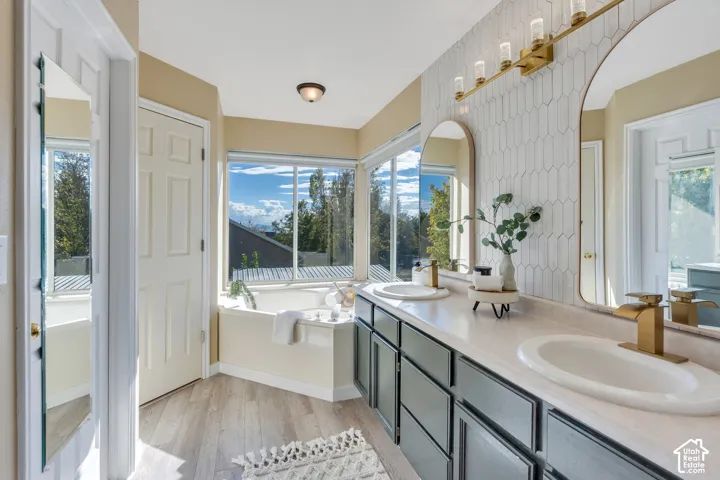 With updated backsplash, fresh painted cabinets, a relaxing soaking tub and separate toilet/shower room!