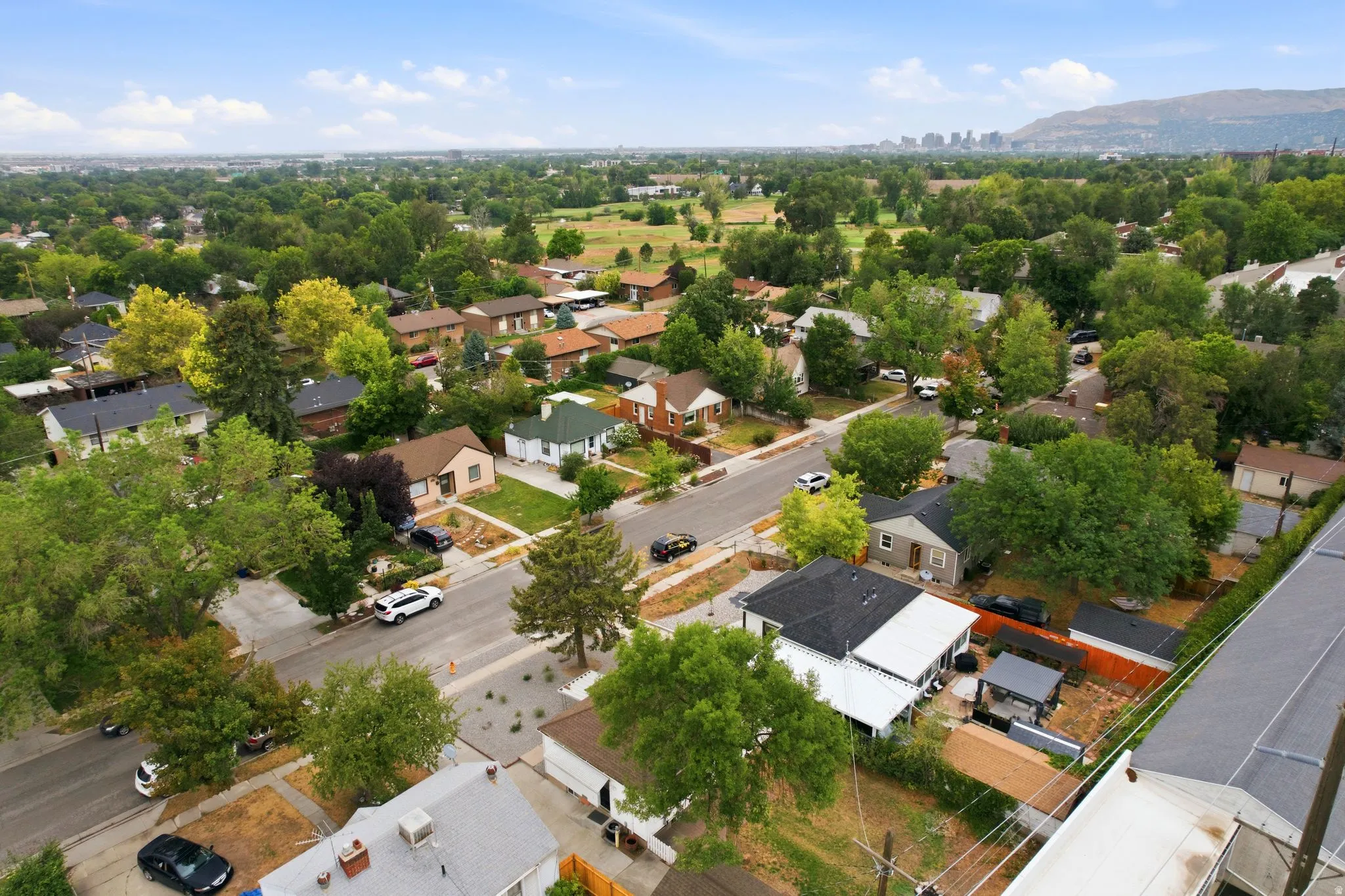 Expansive residential area featuring established homes, mature trees, and paved streets