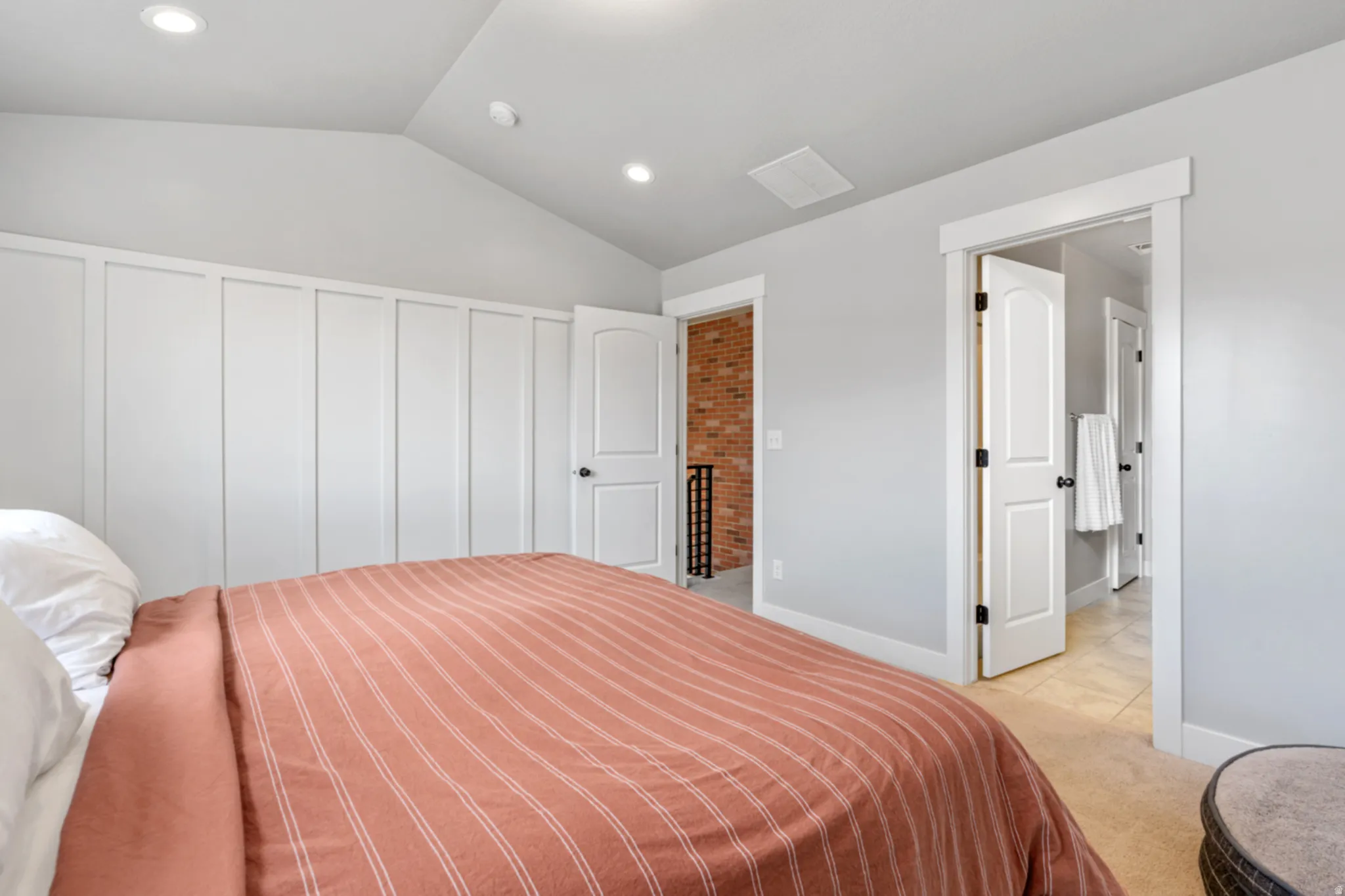 Bedroom featuring board and batten accent wall, recessed lighting, vaulted ceiling, and carpeted flooring