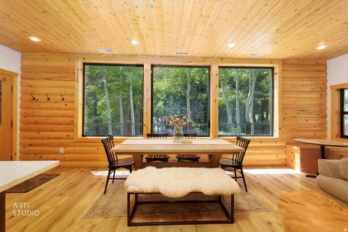 Dining area featuring three expansive windows to take in the beauty of the outdoors.