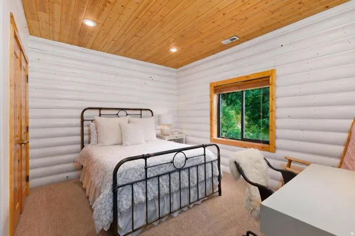 Wood plank ceiling with recessed lighting