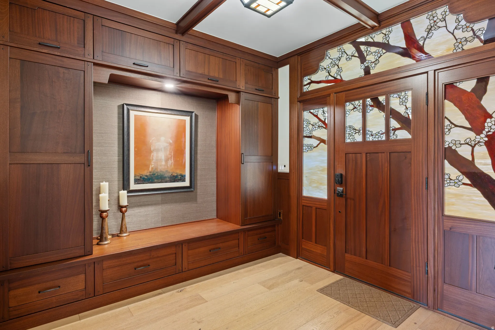 Rich wood-finish custom cabinetry with integrated bench seating and drawer storage