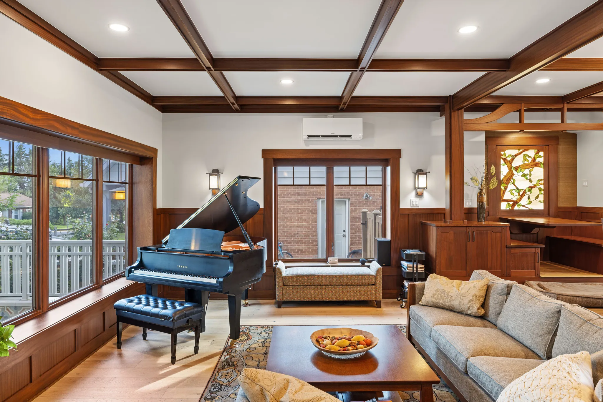 Living area with extensive wood trim and wainscoting