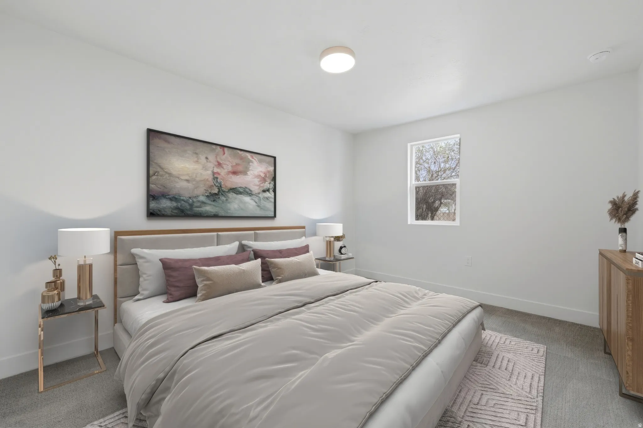 Bright room featuring light gray walls, a single window with white trim, and light gray carpet flooring