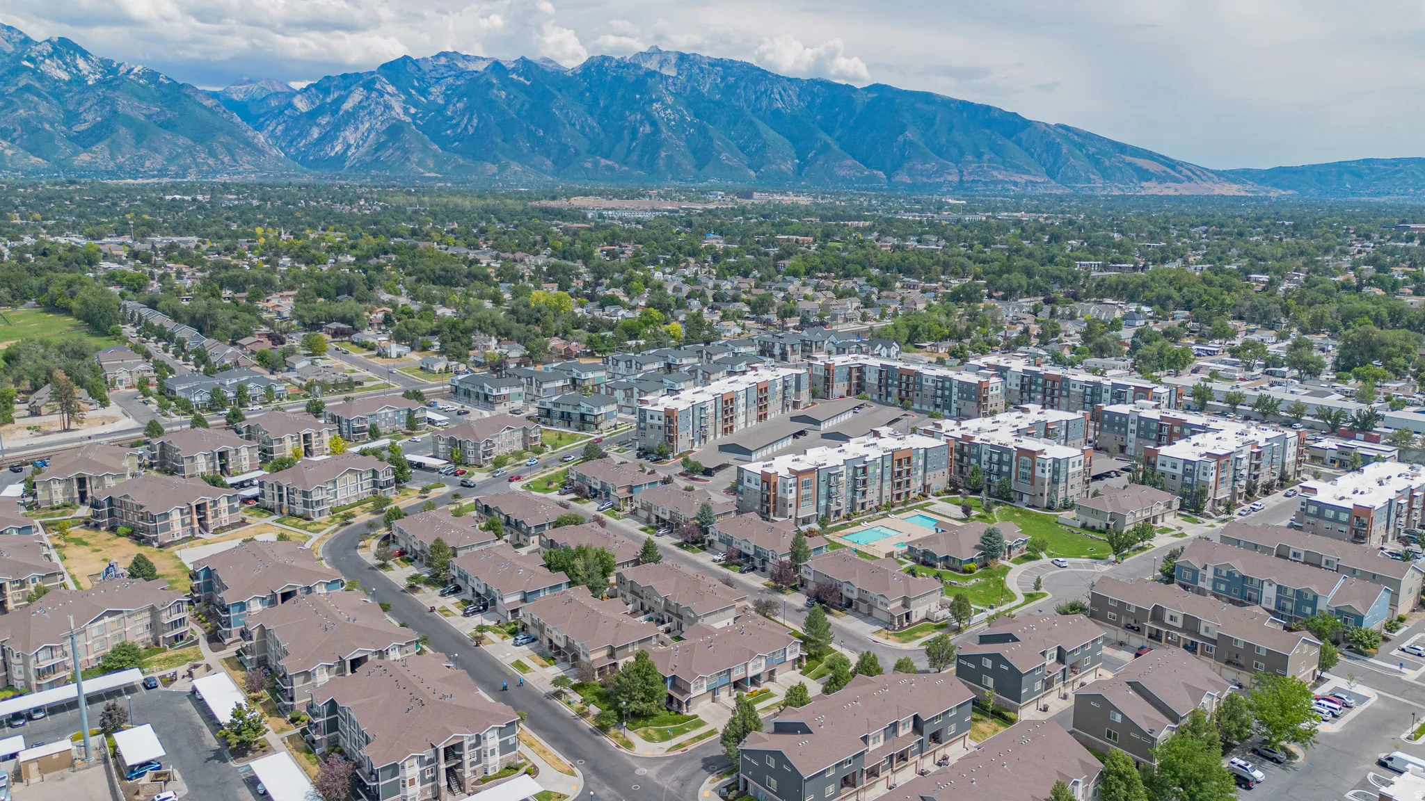 Expansive residential development featuring a variety of multi-story buildings and townhomes
