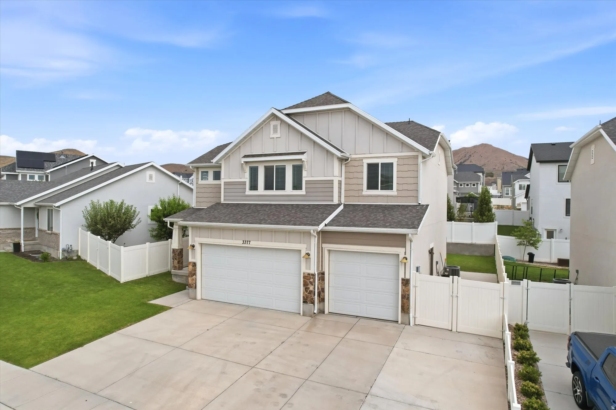 Modern two-story residence featuring a two-car garage and a concrete driveway