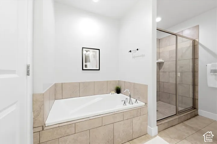 Soaking tub with a tiled surround and chrome fixtures