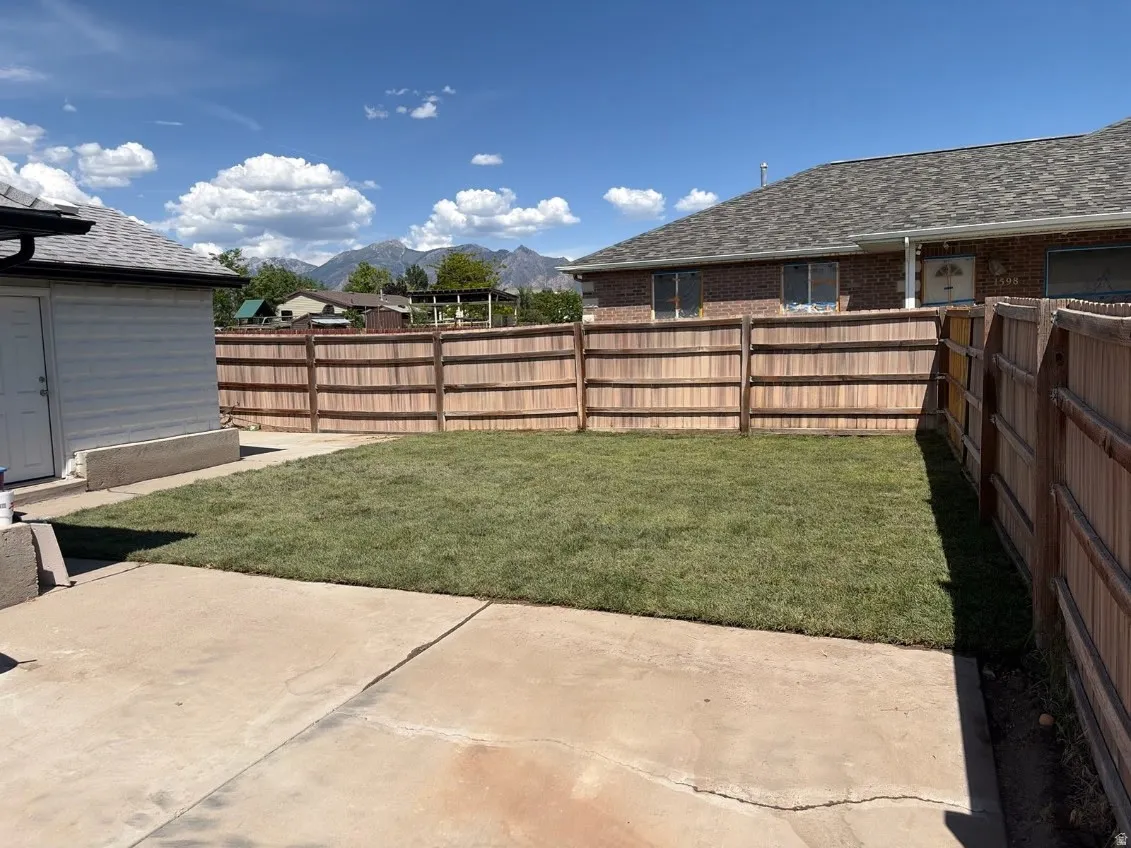 Expansive backyard featuring a newly laid lawn