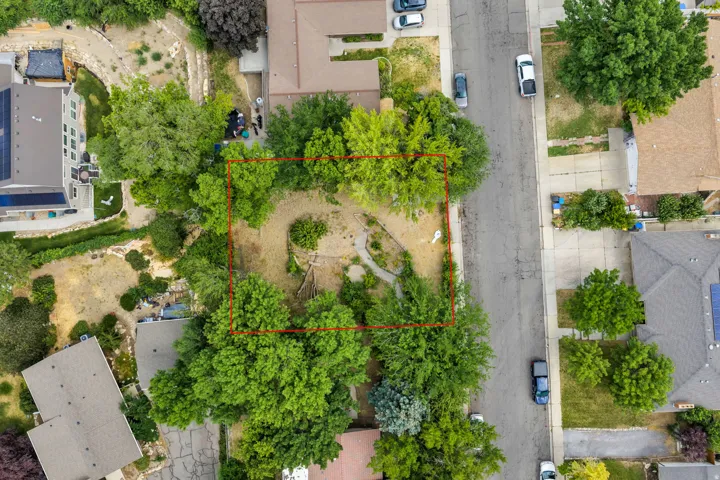 Residential lot featuring mature trees and established landscaping