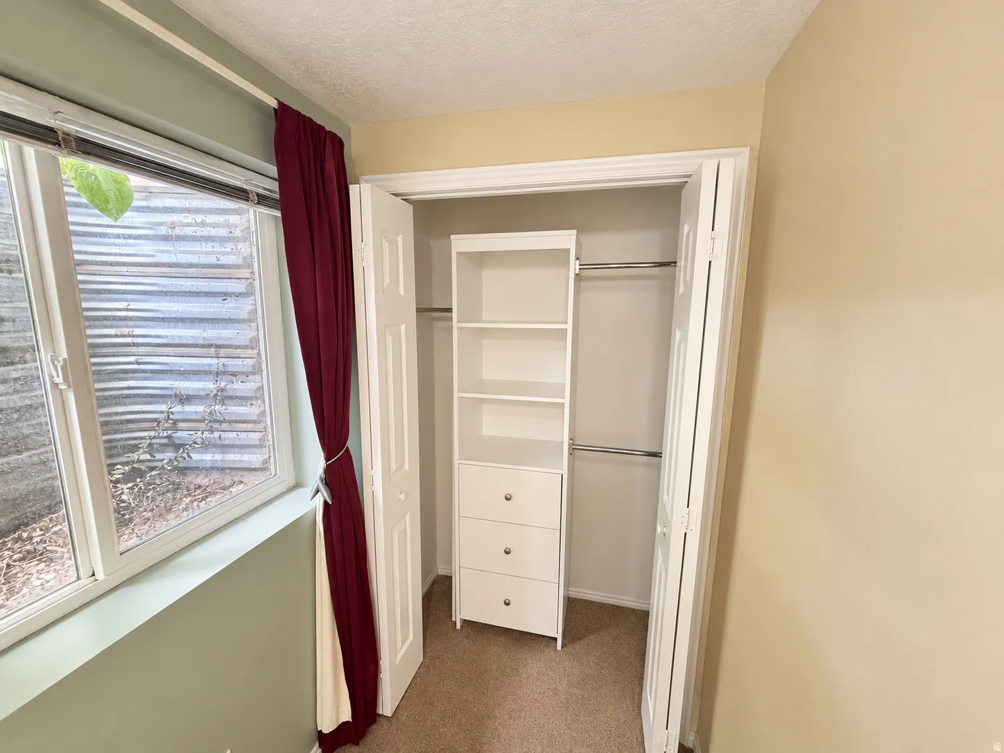Built-in closet organization system with shelving and drawers