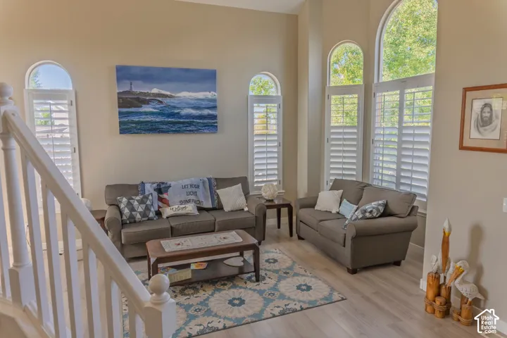 Living area featuring light wood-finish flooring and neutral wall tones