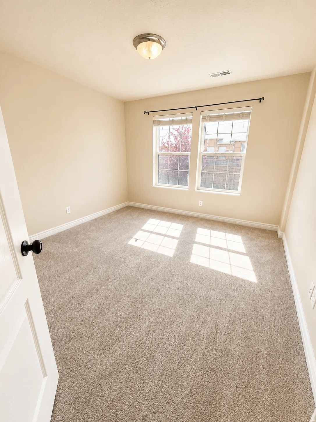 Neutral-toned carpeting throughout