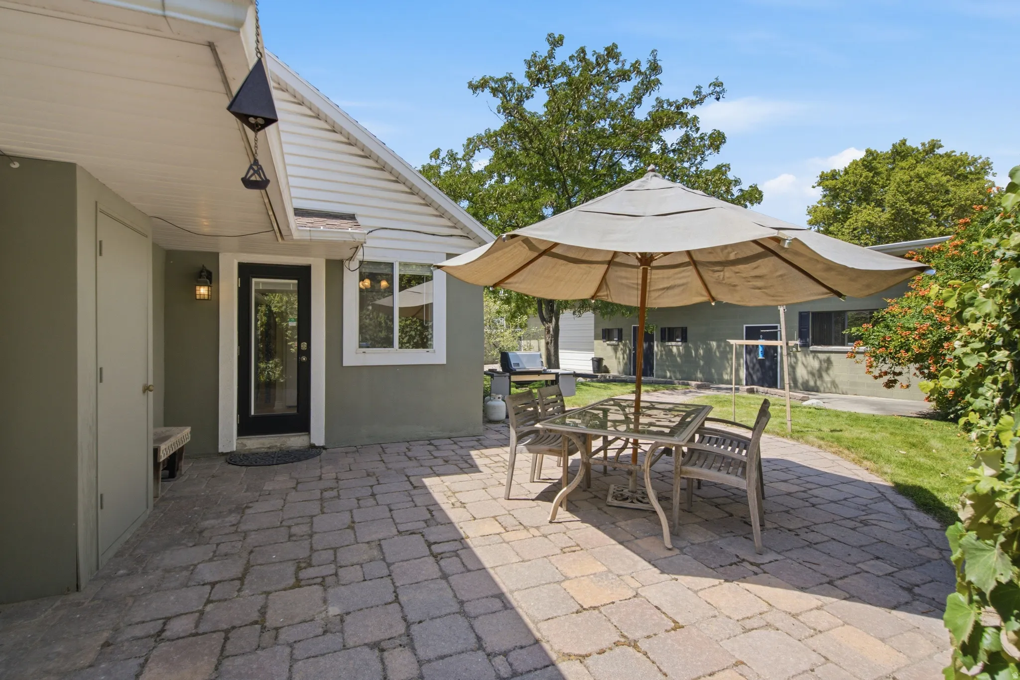 Expansive paver patio with direct access to the interior