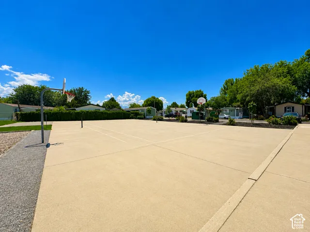 Multi-sport court featuring a concrete surface, basketball hoops