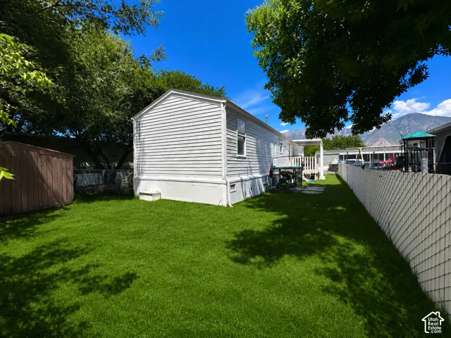 View of backyard with a shed- Grass has been altered. Owners are practicing drought guidelines.
