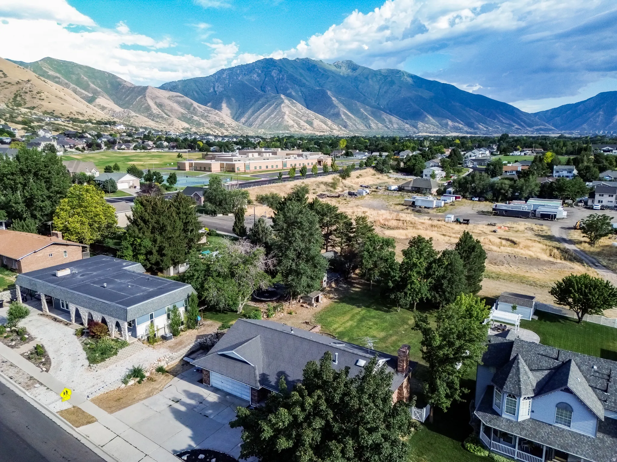 Expansive mountain range backdrop framing a residential area