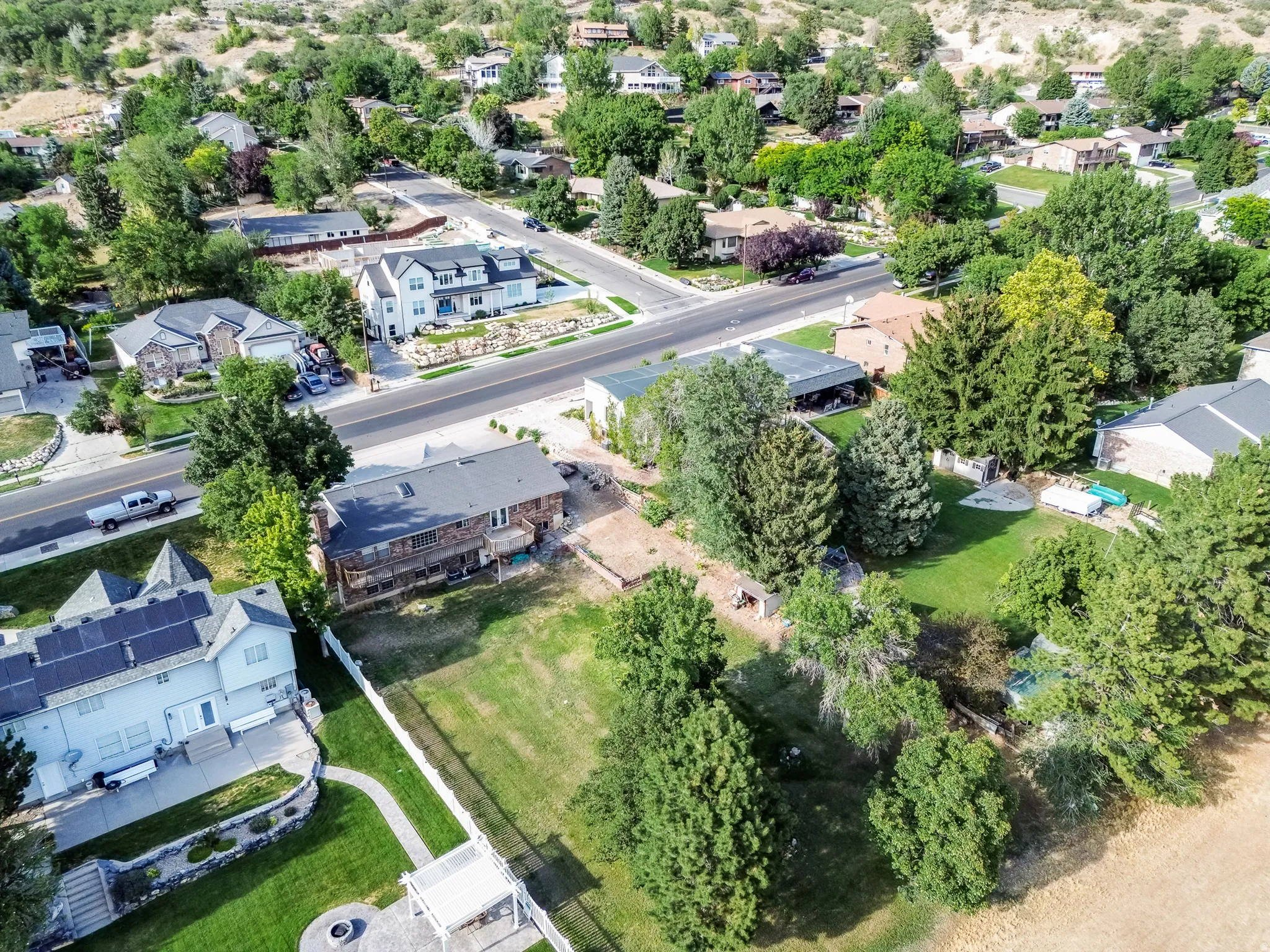 Aerial landscape showcasing a residential area with mature trees and varied architectural styles