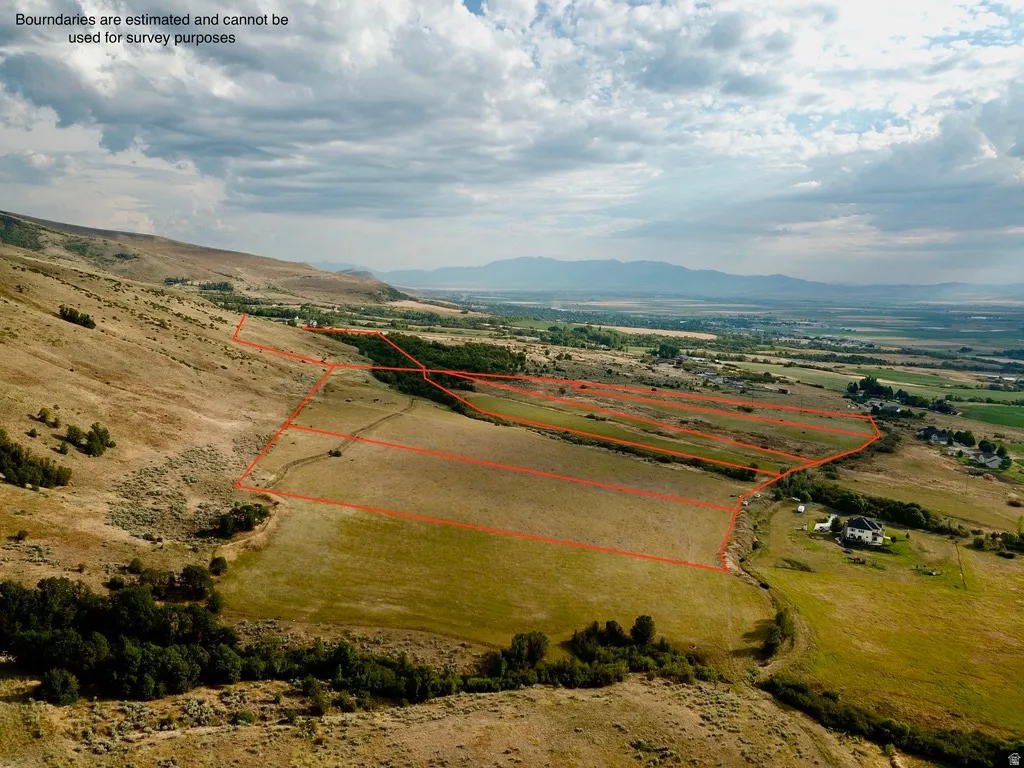 Expansive undeveloped land parcels featuring varied terrain and distant mountain ranges